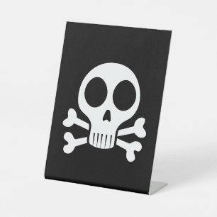 spooky skull on a black background pedestal sign