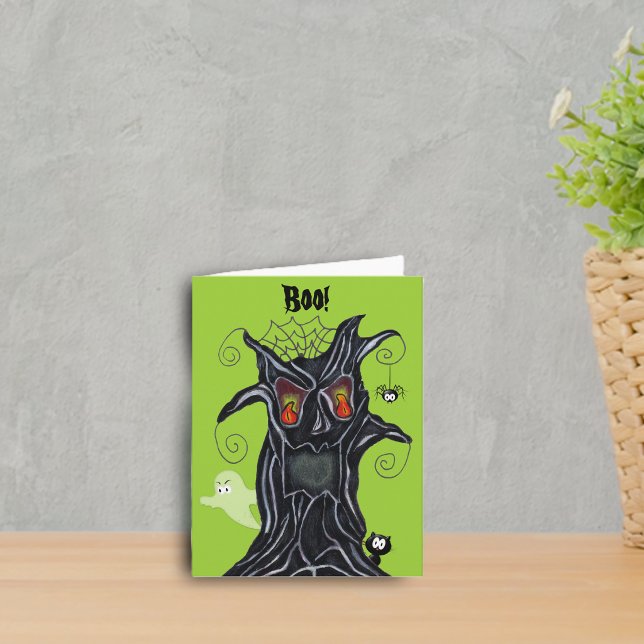 Spooky Tree With Friends Note Card (Spooky black tree red eyes ghost, cat, spider on green Halloween notecard.)