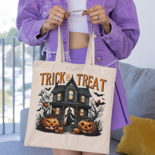 Spooky trick or treat night at a haunted house tote bag