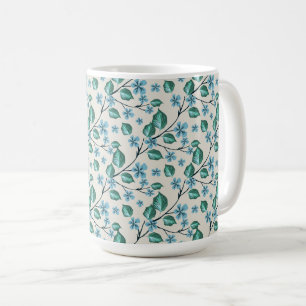 Sprigs with green leaves and blue flowers. coffee mug