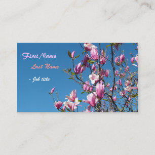 Spring pink magnolia flowers in blue sky business card