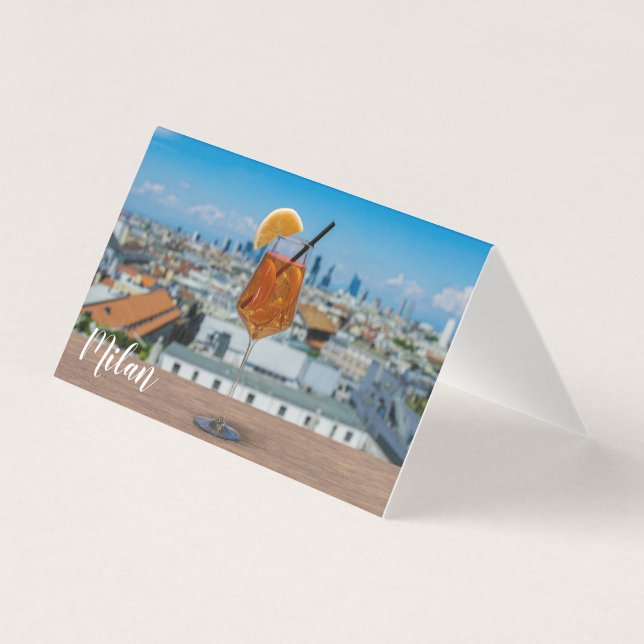 Spritz cocktail on a table with view of Milan (Front)