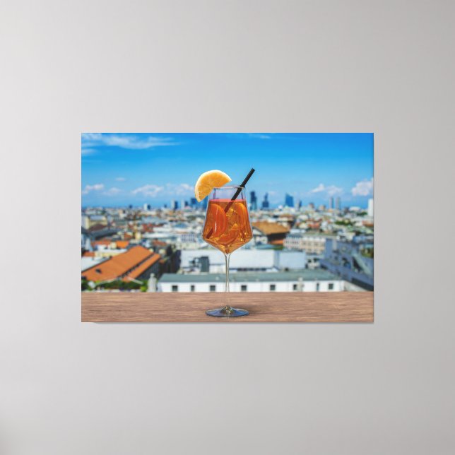 Spritz cocktail on a table with view of Milan Canvas Print (Front)