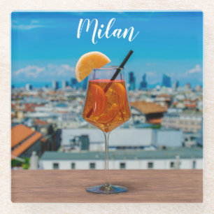 Spritz cocktail on a table with view of Milan Glass Coaster