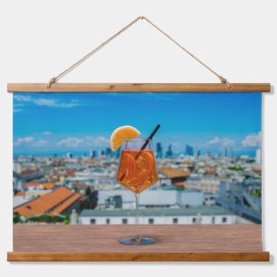 Spritz cocktail on a table with view of Milan Hanging Tapestry
