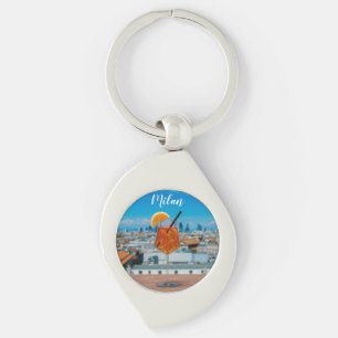 Spritz cocktail on a table with view of Milan Key Ring