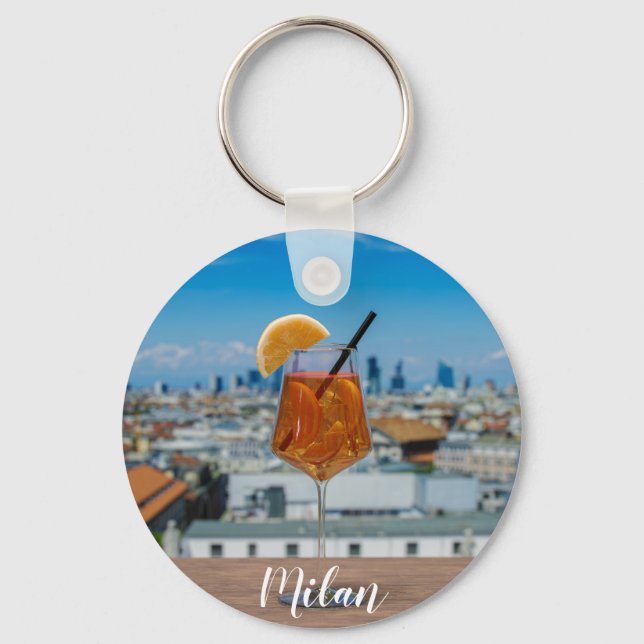 Spritz cocktail on a table with view of Milan Key Ring (Front)