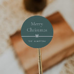 Spruce | Modern Bow Simple Minimal Christmas Classic Round Sticker<br><div class="desc">Finish your holiday mailings and gifts with these sweet and simple Christmas stickers,  customisable with your preferred holiday greeting and family signature (shown with "Merry Christmas") on a soft spruce green background. A petite bow running through the centre completes this elegant minimalist holiday design.</div>