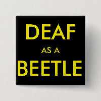 Square black button/pin, "Deaf as a Beetle"