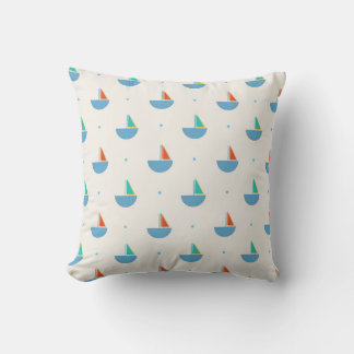 Square pillow with sailboat pattern