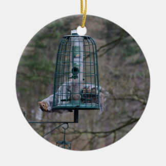 Squirrel on bird feeder ceramic tree decoration
