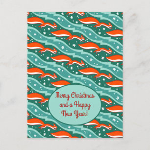 Squirrels jumping in the snow on a dark green tree postcard