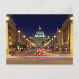 St Peter's Basilica towards end of road at night Postcard