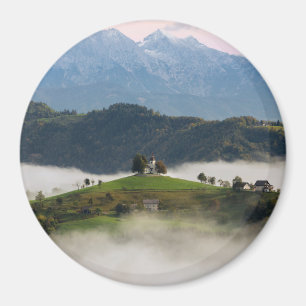 St. Thomas church with mountains in Slovenia round Magnet