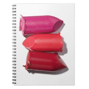 Stack of broken lipstick spiral notebook