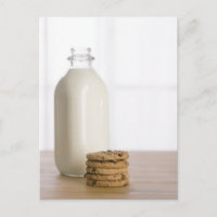 Stack of chocolate chip cookies milk in a glass