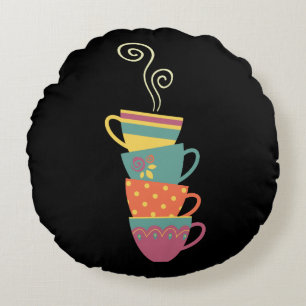 Stacked porcelain cups, tea, coffee steaming round cushion