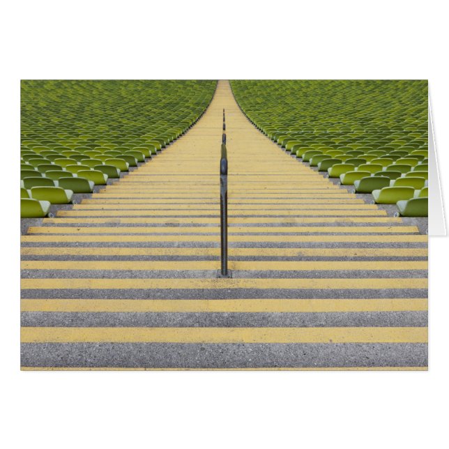 Stadium stairway between rows of green seats (Front Horizontal)