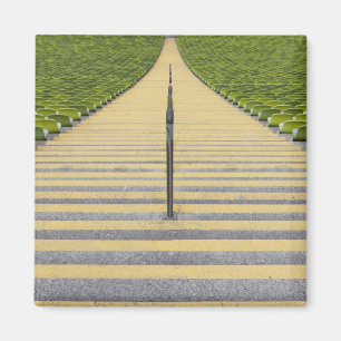 Stadium stairway between rows of green seats magnet