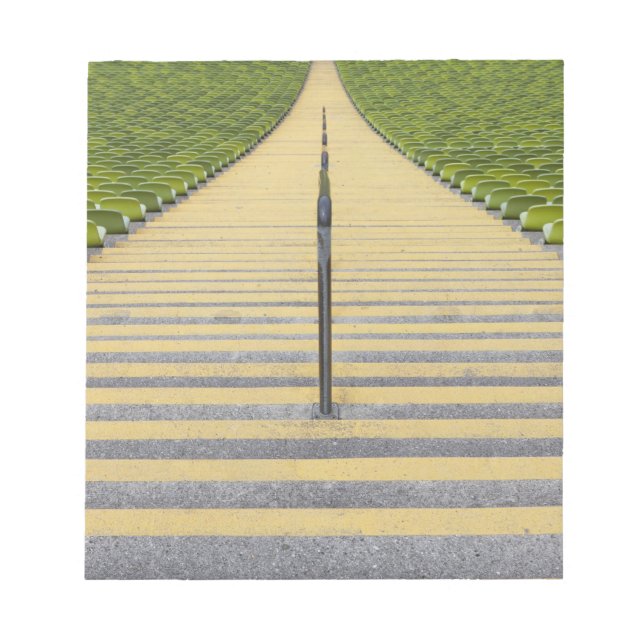 Stadium stairway between rows of green seats notepad (Front)