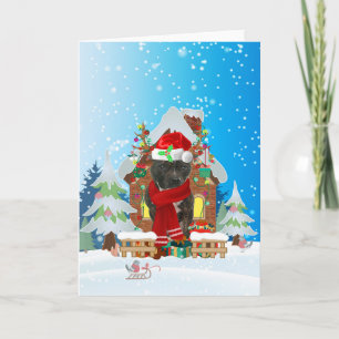 Staffordshire Bull Terrier in snow with Christmas Card