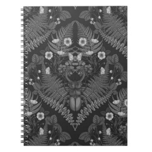 Stag beetle and ferns, in black and white notebook