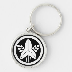 Standing arrowhead in a circle key ring