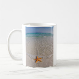 Starfish on beach coffee mug