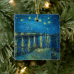Starry Night Over the Rhône | Vincent van Gogh<br><div class="desc">Starry Night Over the Rhône (1888) by Vincent van Gogh is a mesmerising Post-Impressionist painting that captures a serene nighttime view of the Rhône River in Arles, France. The artwork features a deep blue sky adorned with shimmering golden stars and their reflections on the water. In the foreground, two figures...</div>