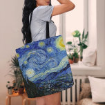 Starry Night | Vincent Van Gogh Tote Bag<br><div class="desc">Starry Night (1889) by Dutch artist Vincent Van Gogh. Original artwork is an oil on canvas depicting an energetic post-impressionist night sky in moody shades of blue and yellow. 

Use the design tools to add custom text or personalise the image.</div>