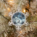 Starry Winter Night Deer Snowflake Pewter Christmas Ornament<br><div class="desc">A graceful stag stands beneath a shimmering winter sky, framed by snow-dusted pines and delicate bare trees. The deep midnight blues fade into frosty whites, while stars and snowflakes scatter like jewels across the heavens. This dreamy woodland scene captures the quiet wonder of a snowy night, blending cottagecore warmth with...</div>