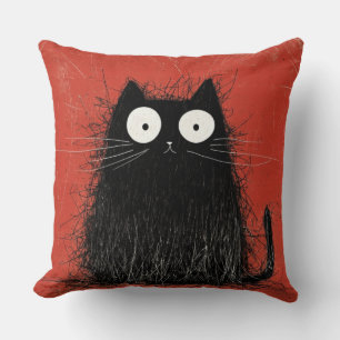 Startled Black Cat on Vivid Crimson Cushion