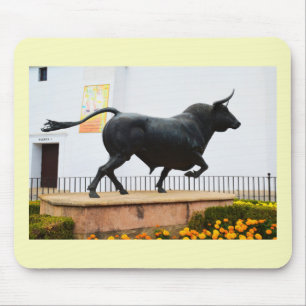 Statue of a bull mouse pad
