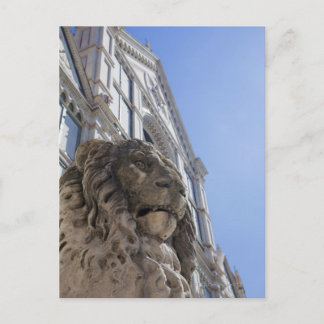 statue of a lion with the facade of Santa Croce Postcard