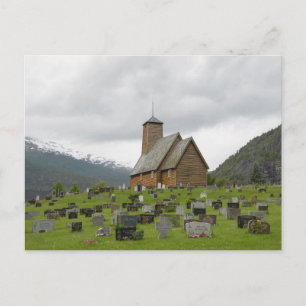 Stave church with graveyard in Norway postcard