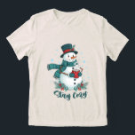 Stay Cozy Winter Snowman With Hot Cocoa Tri-Blend Shirt<br><div class="desc">A charming winter illustration featuring a stylish snowman dressed in a cozy patterned scarf and elegant top hat, holding a warm cup of hot cocoa. Surrounded by snowflakes, pine branches, and festive red berries, this design brings a warm and joyful holiday feeling. Perfect for winter apparel, Christmas gifts, seasonal mugs,...</div>