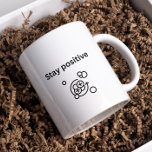 Stay positive- proton chemistry | Science |  Coffee Mug<br><div class="desc">A unique positivity design tote bag for chemist. Stay positive. Positivity Mug. Chemistry positivity. This print for a mug features a minimalist design with the encouraging phrase “Stay positive” and a simple line drawing of an atom or molecule, symbolising positivity at a microscopic level. The image is in black and...</div>