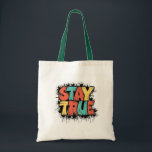 Stay True Tote Bag - Authenticity and Individualit<br><div class="desc">Make a statement with this unique tote bag featuring the empowering phrase 'STAY TRUE' in bold,  colourful letters. Perfect for daily use,  shopping,  or as a gift for friends and family who value authenticity and individuality. Made from high-quality materials,  this tote bag is both functional and fashionable."</div>