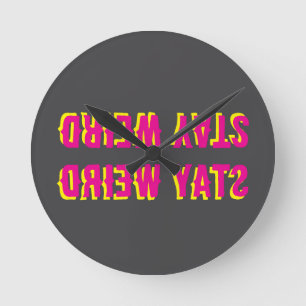 stay weird text pink round clock