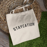 Staycation | Modern Minimalist Stylish Trendy Tote Bag<br><div class="desc">Simple, stylish "Staycation" custom quote art tote bag with modern, minimalist typography in black in a bold trendy style. The perfect gift or accessory for a vacation at home during the covid-19 coronavirus pandemic during periods of lockdown and travel restrictions.The words can easily be personalised with your own message for...</div>