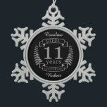 Steel Eleventh wedding anniversary 11 years Snowflake Pewter Christmas Ornament<br><div class="desc">A design to celebrate 11 years of marriage. This design has a grey (steel) coloured laurel design on a black background. Steel is the traditional gift for this occasion. The text reads Steel 11 years anniversary. A romantic design to celebrate your 11th year of marriage. If you would like any...</div>