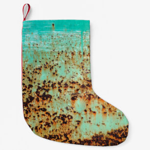 steel surface. An old weathered Green Small Christmas Stocking