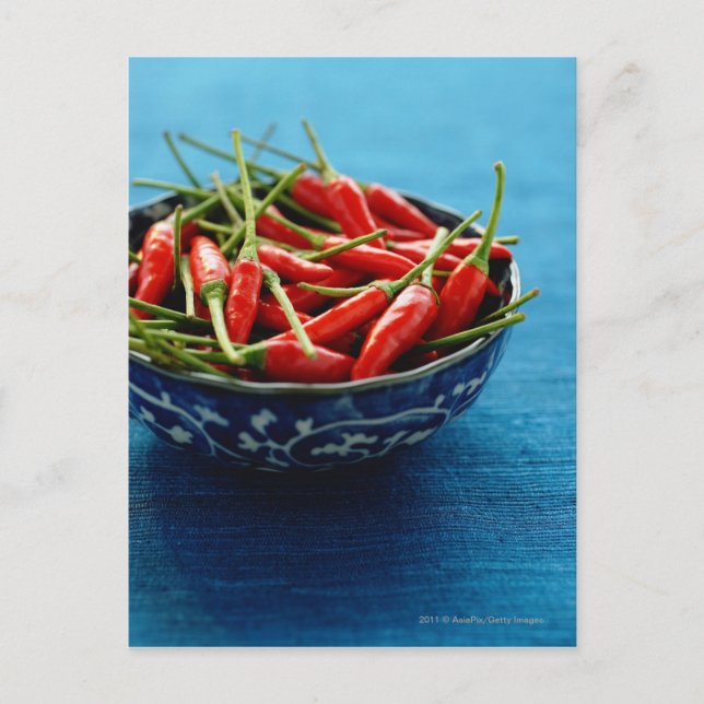 Still life of chilies in bowl on blue mat postcard (Front)