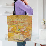 Still Life with French Novels | Vincent van Gogh Tote Bag<br><div class="desc">Still Life with French Novels and Glass with a Rose (1887) by Dutch post-impressionist artist Vincent Van Gogh. Original artwork is an oil on canvas depicting an stacks of books in warm yellow tones.

Use the design tools to add custom text or personalise the image.</div>