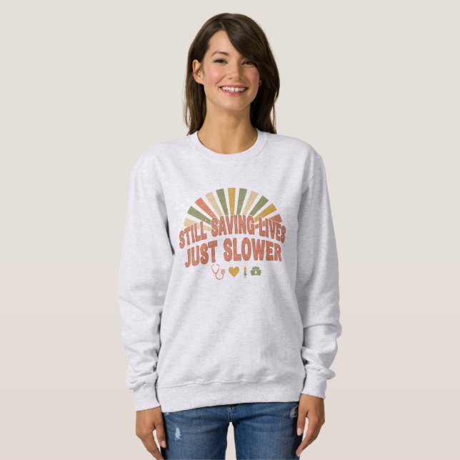 Still Saving Lives Just Slower Funny Retired Nurse Sweatshirt (Front Full)