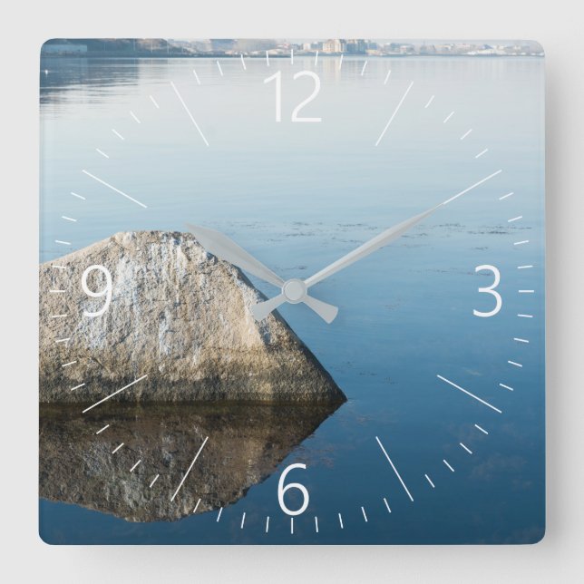 Stone and its reflection at sea surface square wall clock (Front)