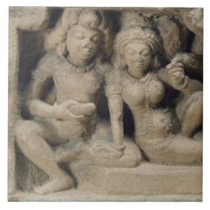 Stone carving of lovers enjoying a dance performan tile