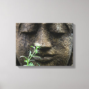 Stone garden statue with flower canvas print