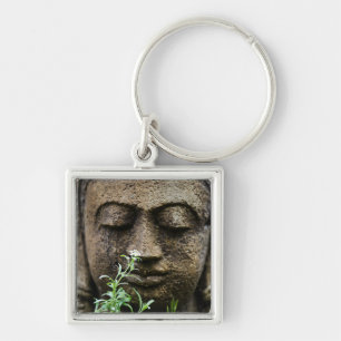 Stone garden statue with flower key ring