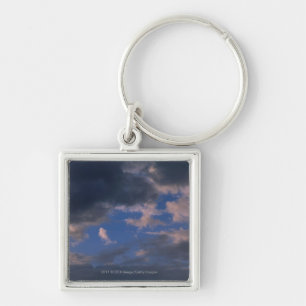 Storm clouds against blue sky key ring